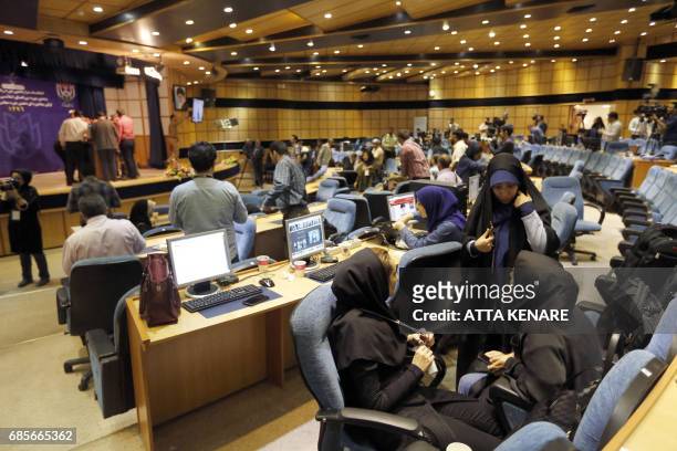 Iranian journalists follow the results of the Presidential election at the Interior Ministry's press room in the capital Tehran on May 20, 2017.