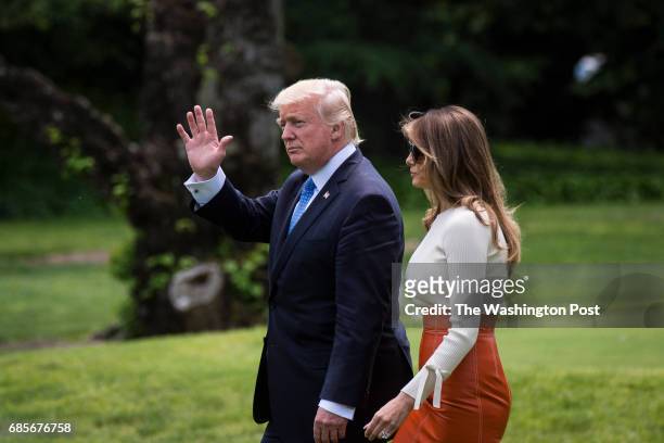President Donald Trump and first lady Melania Trump walk across the South Lawn to board Marine One and fly to Andrews Air Force Base, Md., at the...