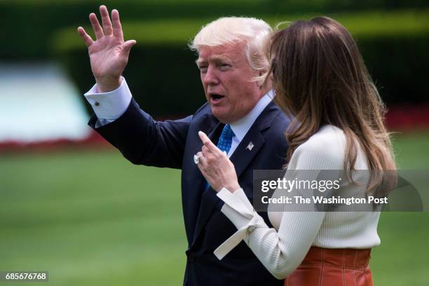 President Donald Trump and first lady Melania Trump walk across the South Lawn to board Marine One and fly to Andrews Air Force Base, Md., at the...