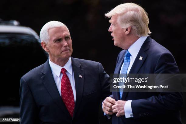 Vice President Mike Pence sees off President Donald Trump as he walks across the South Lawn to board Marine One and for a short trip to Andrews Air...
