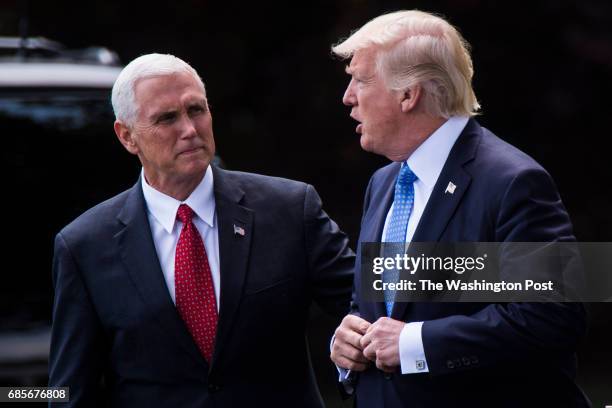 Vice President Mike Pence sees off President Donald Trump as he walks across the South Lawn to board Marine One and for a short trip to Andrews Air...