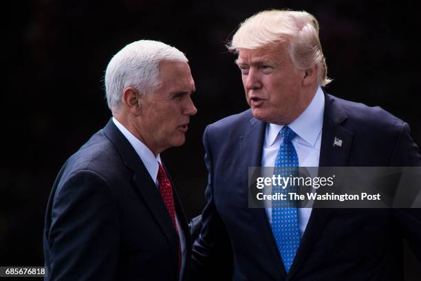 Vice President Mike Pence sees off President Donald Trump as he walks across the South Lawn to board Marine One and for a short trip to Andrews Air...