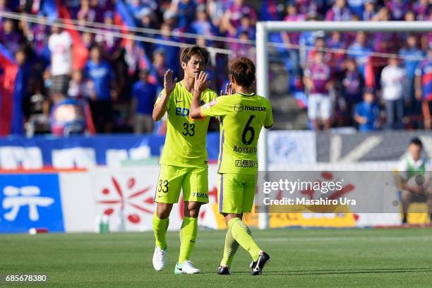 Tsukasa Shiotani and Toshihiro Aoyama of Sanfrecce Hiroshima celebrate their 2-1 victory after the J.League J1 match between Ventforet Kofu and...