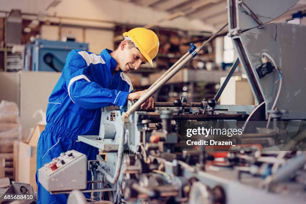 precision mechanics in industry - engineer gearwheel factory stock pictures, royalty-free photos & images