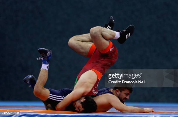 Raxmatulla Murtazali Muslimov of Azerbaijan competes against Zafar Dama of Turkey in the Mens Freestyle Wrestling 70 kg Quater Final during day nine...