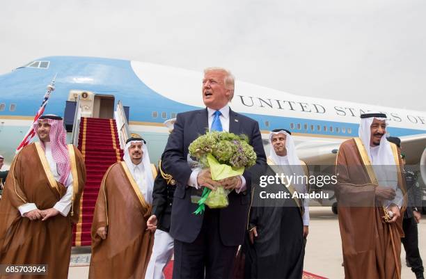 President Donald Trump is welcomed by Saudi Arabia's King Salman bin Abdulaziz Al Saud during their arrival at the King Khalid International Airport...