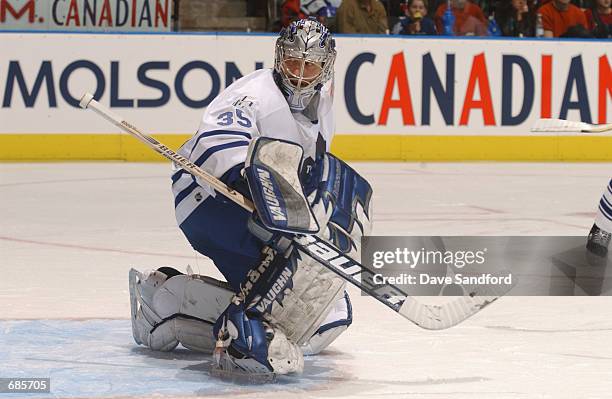 Goaltender Corey Schwab of the Toronto Maple Leafs eyes the play behind him against the Florida Panthers during the NHL game at Air Canada Centre in...