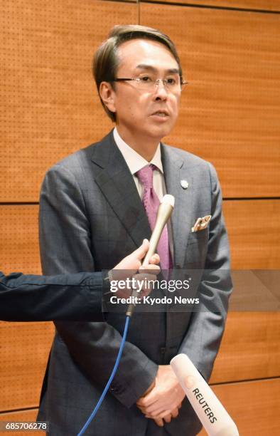 Nobuteru Ishihara, Japan's minister in charge of Trans-Pacific Partnership free trade talks, speaks to reporters after a series of bilateral meetings...