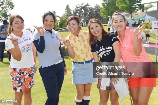 Players pose for photographers after the final round of the Twin Fields Ladies Tournament at the Golf Club Twin Fields on May 19, 2017 in Komatsu,...