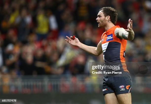 Nathan Wilson of the Giants remonstrates with the goal umpire after the shot on goal from Shai Bolton of the Tigers was touched during the round nine...