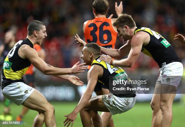 Shai Bolton of the Tigers celebrates before his shot on goal was ruled to have been touched during the round nine AFL match between the Greater...