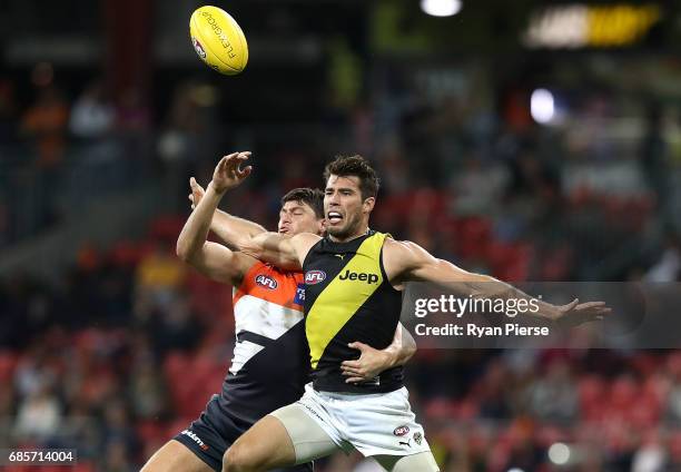 Jonathon Patton of the Giants competes for the ball against Alex Rance of the Tigers during the round nine AFL match between the Greater Western...