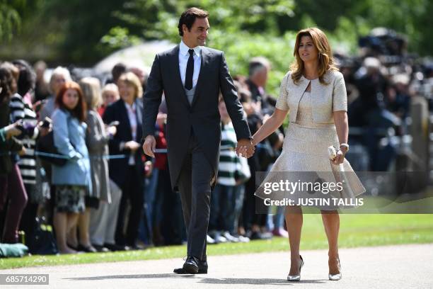 Swiss tennis player Roger Federer and his wife Mirka attend the wedding of Pippa Middleton and James Matthews at St Mark's Church in Englefield, west...