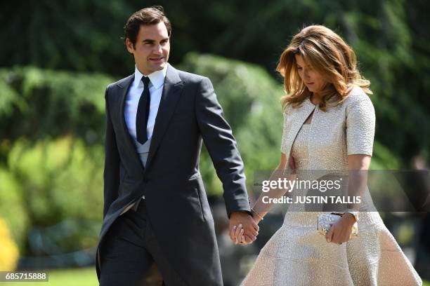 Swiss tennis player Roger Federer and his wife Mirka attend the wedding of Pippa Middleton and James Matthews at St Mark's Church in Englefield, west...