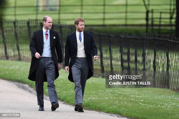 Britain's Prince Harry and Britain's Prince William, Duke of Cambridge walk to the church for the wedding of Pippa Middleton and James Matthews at St...