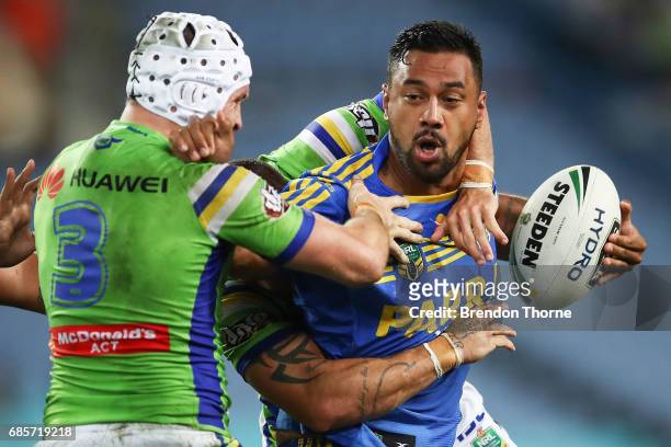 Kenneth Edwards of the Eels is tackled by Jarrod Croker of the Raiders during the round 11 NRL match between the Parramatta Eels and the Canberra...