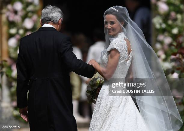 Pippa Middleton, is escorted by her father Michael Middleton, as she arrives for her wedding to James Matthews at St Mark's Church in Englefield,...