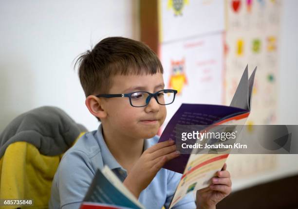students at catholic school. - kids reading glasses stock pictures, royalty-free photos & images