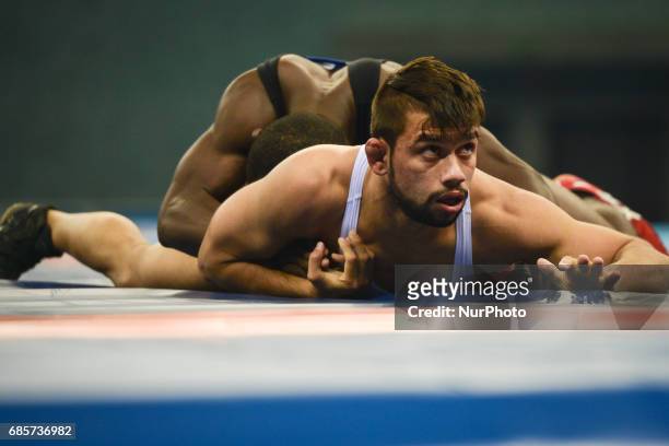 Abdul Wahab of Pakistan competes against Alain Lago Guy of Ivory Cost in the Mens Freestyle Wrestling 61kg semi-finals during Baku 2017 - 4th Islamic...
