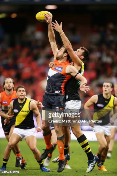 Shane Mumford of the Giants is challenged by Toby Nankervis of the Tigers during the round nine AFL match between the Greater Western Sydney Giants...