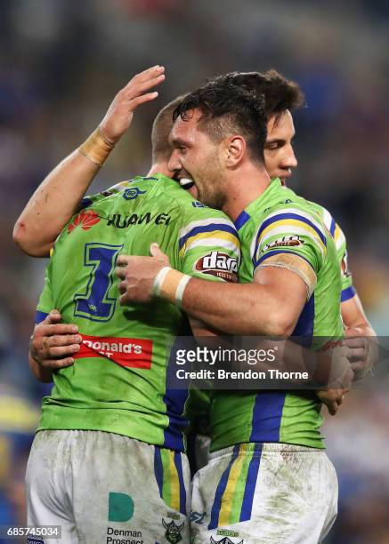 Jack Wighton of the Raiders celerates with team mate Jordan Rapana after a try saving tackle against the Eels at full time during the round 11 NRL...