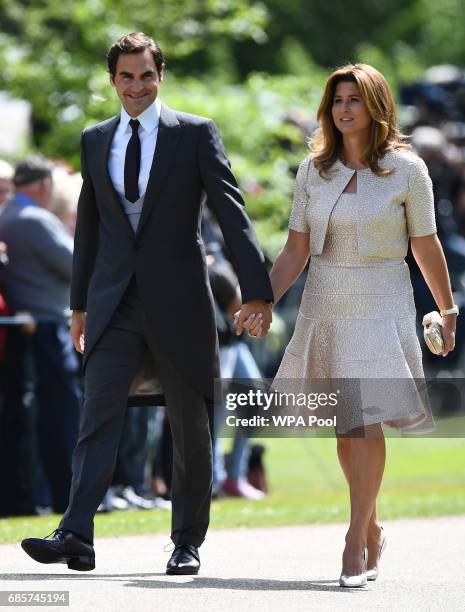 Swiss tennis player Roger Federer and his wife Mirka attend the wedding of Pippa Middleton and James Matthews at St Mark's Church on May 20, 2017 in...