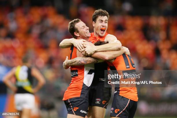 Jeremy Cameron of the Giants celebrates victory with Steve Johnson of the Giants at fulltime during the round nine AFL match between the Greater...