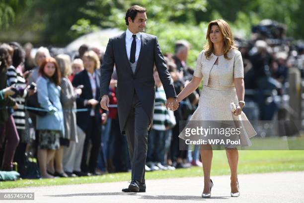 Swiss tennis player Roger Federer and his wife Mirka attend the wedding of Pippa Middleton and James Matthews at St Mark's Church on May 20, 2017 in...