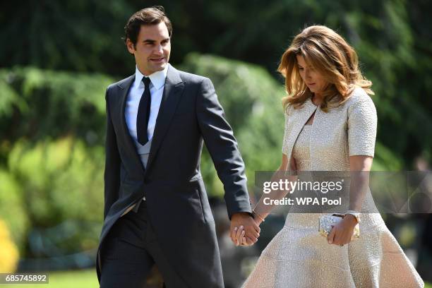 Swiss tennis player Roger Federer and his wife Mirka attend the wedding of Pippa Middleton and James Matthews at St Mark's Church on May 20, 2017 in...