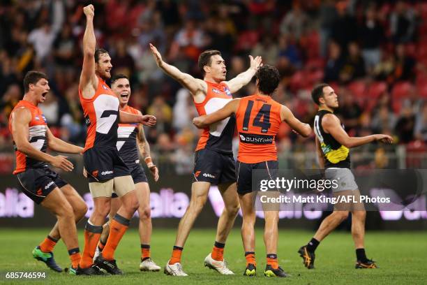 Jeremy Cameron of the Giants celebrates with team mates after kicking the winning goal during the round nine AFL match between the Greater Western...