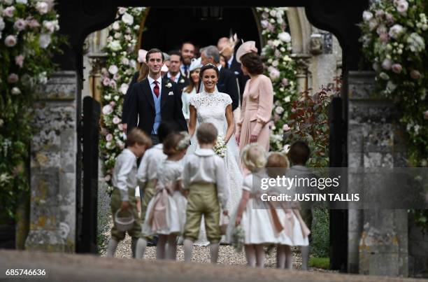 Pippa Middleton poses for a photograph with her new husband James Matthews , following their wedding ceremony at St Mark's Church in Englefield, west...