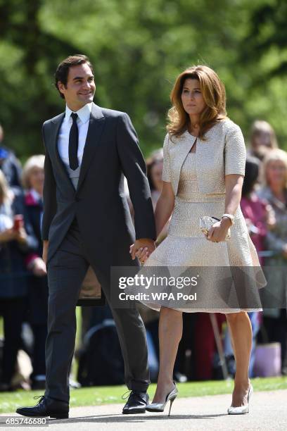 Swiss tennis player Roger Federer and his wife Mirka attend the wedding of Pippa Middleton and James Matthews at St Mark's Church on May 20, 2017 in...