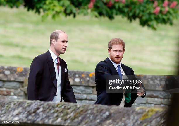 Britain's Prince William, left, and his brother Prince Harry arrive for the wedding of Pippa Middleton and James Matthews at St Mark's Church on May...