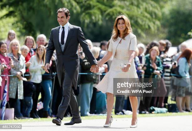 Swiss tennis player Roger Federer and his wife Mirka arrive at St Mark's Church ahead of the wedding of Pippa Middleton and James Matthews on May 20,...