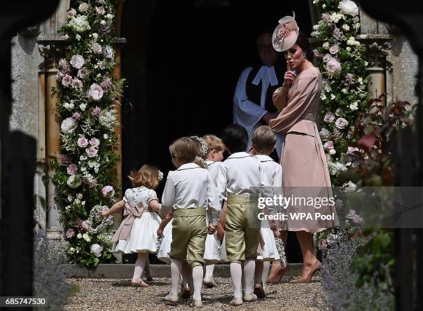 Britain's Catherine, Duchess of Cambridge walks with the bridesmaids and pageboys as they arrive as they arrive for her sister Pippa Middleton's...