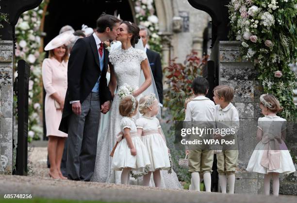 Pippa Middleton and James Matthews kiss after their wedding at St Mark's Church on May 20, 2017 in Englefield, England. Middleton, the sister of...