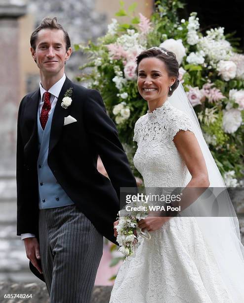 Pippa Middleton and James Matthews smile for the cameras after their wedding at St Mark's Church on May 20, 2017 in Englefield, England. Middleton,...