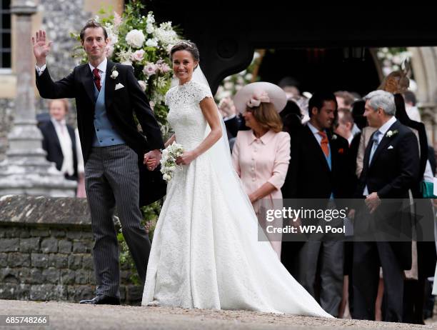 Pippa Middleton and James Matthews smile for the cameras after their wedding at St Mark's Church on May 20, 2017 in Englefield, England. Middleton,...