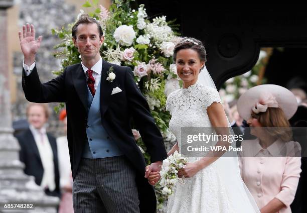 Pippa Middleton and James Matthews smile for the cameras after their wedding at St Mark's Church on May 20, 2017 in Englefield, England. Middleton,...