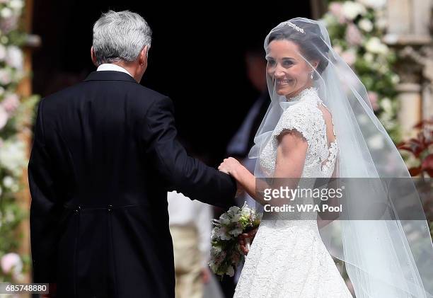 Pippa Middleton arrives with her father Michael Middleton for her wedding to James Matthews at St Mark's Churchon May 20, 2017 in Englefield,...