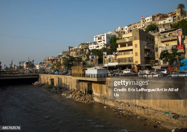 Polluted river crossing residential apartments and housing, North Governorate, Tripoli, Lebanon on April 29, 2017 in Tripoli, Lebanon.