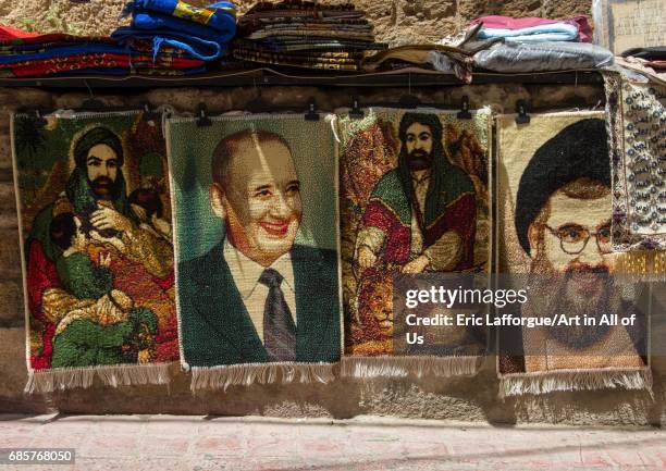 Sheikh Hassan Nasrallah and ali carpets for sale in the street, South Governorate, Tyre, Lebanon on May 3, 2017 in Tyre, Lebanon.