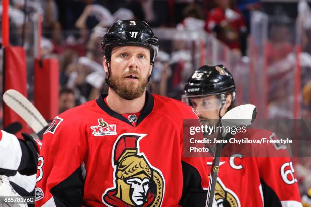 Marc Methot of the Ottawa Senators celebrates a first period goal by teammate Zack Smith with Erik Karlsson against the Pittsburgh Penguins in Game...