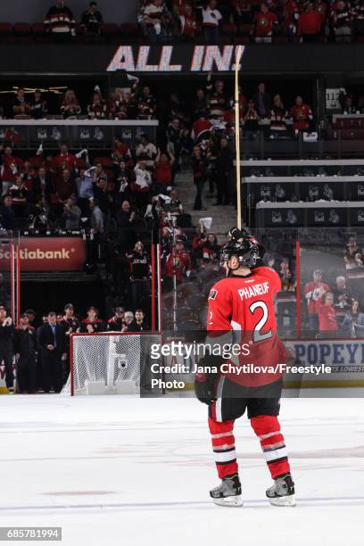 Dion Phaneuf of the Ottawa Senators acknowledges the fans after being named the third star of the game following their win against the Pittsburgh...