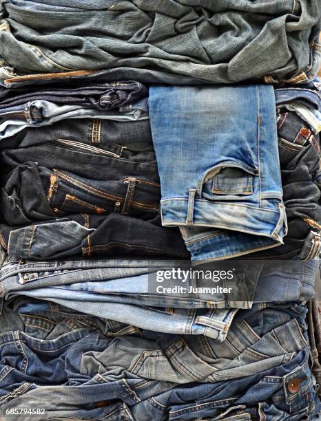 jeans packed for recycling - juampiter fotografías e imágenes de stock