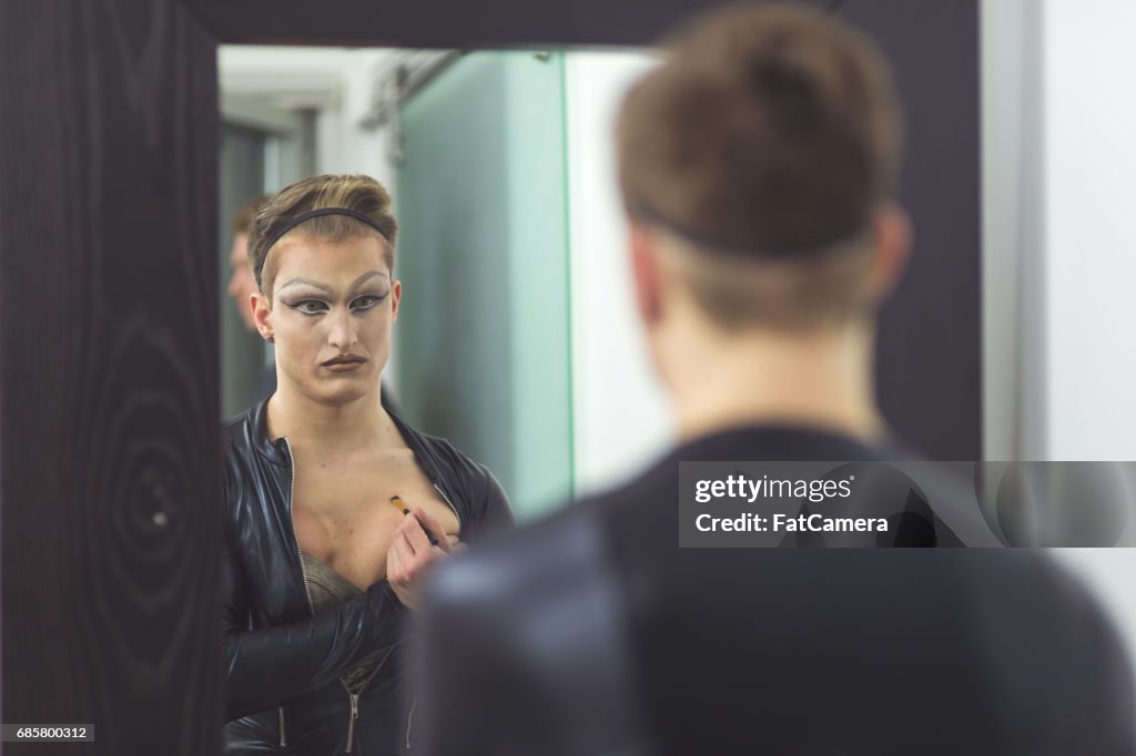 Man gets dressed in drag attire in bathroom