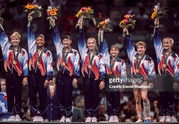 The United States Women's Gymnastics Team of Amanda Borden, Dominique Dawes, Amy Chow, Jaycie Phelps, Dominique Moceanu, Kerri Strug, and Shannon...