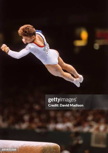 Kerri Strug of the United States performs a vault during the team competition of the Women's Gymnastics event of the 1996 Summer Olympic Games held...