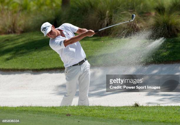Fredrik Jacobson plays out of a bunker on the twelfth fairway during Round 2 of the CIMB Asia Pacific Classic 2011 at the MINES resort and golf club,...