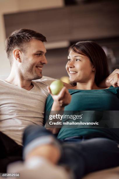 young couple enjoying together - apple credit card stock pictures, royalty-free photos & images